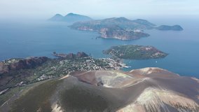 Aerial view 4K video from flying drone of Panoramic view from mountain roadsthe volcano of Vulcano Island in a summer day. The islands of Lipari and Salina Aeolian Islands, Sicily, Italy. (series) - Powered by Shutterstock - Get 15% off with code: PIKWIZARD15