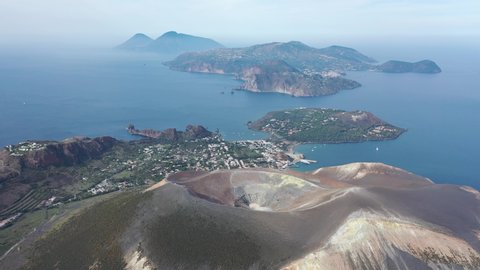 Aerial view 4K video from flying drone of Panoramic view from mountain roadsthe volcano of Vulcano Island in a summer day. The islands of Lipari and Salina Aeolian Islands, Sicily, Italy. (series)