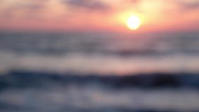 Blurred defocused video clip beautiful clean beach background in yellow sunset.