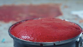 red froth pours out of the pan. making berry syrup. - Powered by Shutterstock - Get 15% off with code: PIKWIZARD15