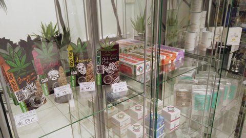 warsaw / Poland - 03 04 2020: Pan of various CBD infused edible products on a shelf inside retail store