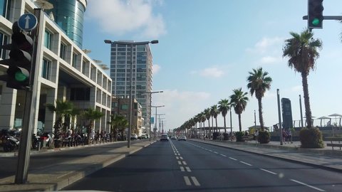 A trip by car in Tel Aviv, the car goes on the road in Tel Aviv, the road to the shore of the sea in Tel Aviv