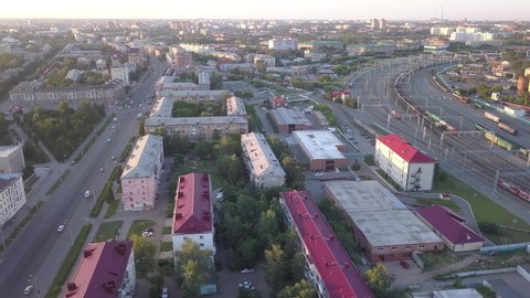 D-Cinelike. Russia, Omsk - July 16, 2018: Panorama of the city at sunset. The central railway station of the city of Omsk., Aerial View