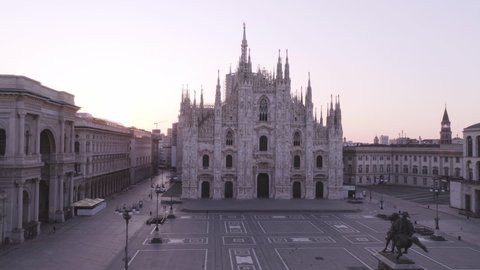 Milan, Italy - May, 2020: Empty square in front of the Duomo Cathedral. Panic from the Chinese viral corona Covid 19 in Italy. Empty streets. Quarantine in Milan. Pandemic. Red zone. 
