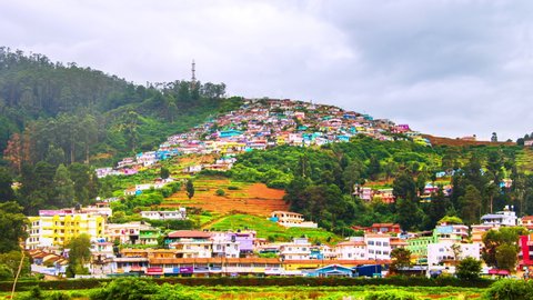 Ooty, India time-lapse during cloudy day. Aerial view of Nilgiri mountain village in Tamil Nadu, India. Ooty is a popular resort with beautiful nature, zoom in