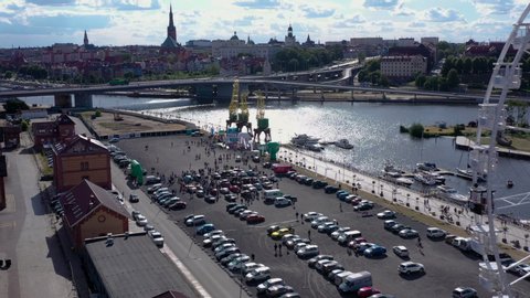 Szczecin, Poland - 07/15/2019: Aerial view of cars race, ferris wheel and Szczecin's panorama, Poland