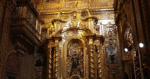 QUITO, ECUADOR - AUG 27, 2019 Interior of Jesuit Church of La Compania in old town in Quito, status fill of gold leaf