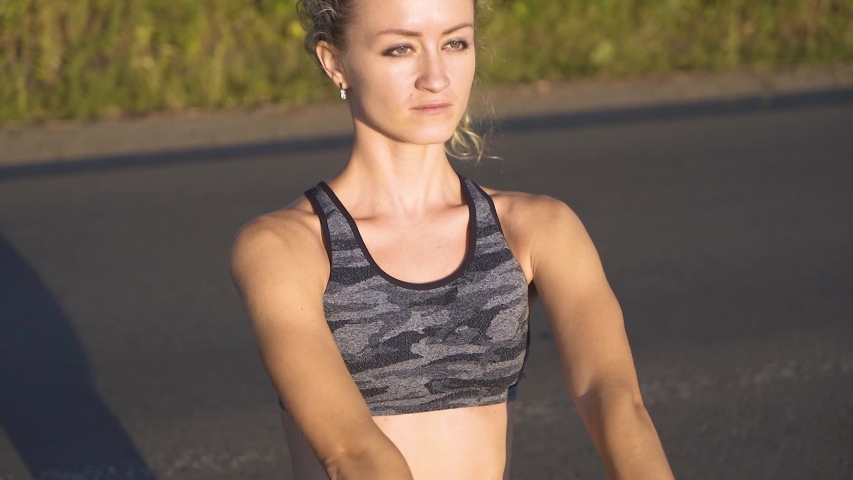 Girl goes in for sports on the street, focused face