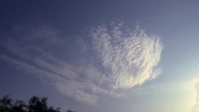 Time Lapse of the sky with soft white clouds flying