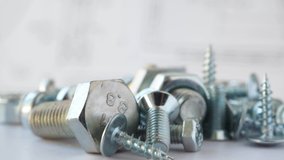 Hardware bolt, nut and screw rotation on the table