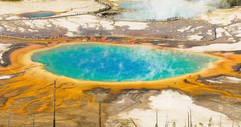 Time lapse shot of Grand Prismatic Spring with tourists on sunny day - Yellowstone National Park, Wyoming