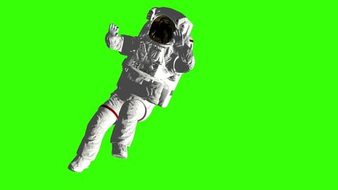 Astronaut falls to Earth in the open space. Spacewalk. Elements of this image furnished by NASA. Green screen.