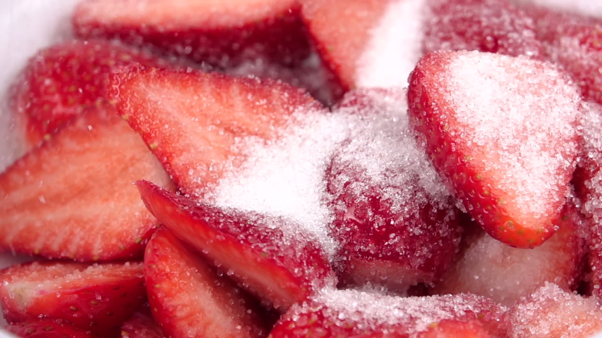 Sprinkle strawberries with sugar. Slow motion 250fps