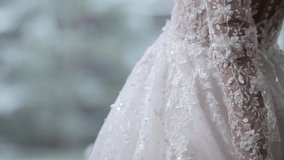 bride stretches hands with white glittering embroidery - Powered by Shutterstock - Get 15% off with code: PIKWIZARD15
