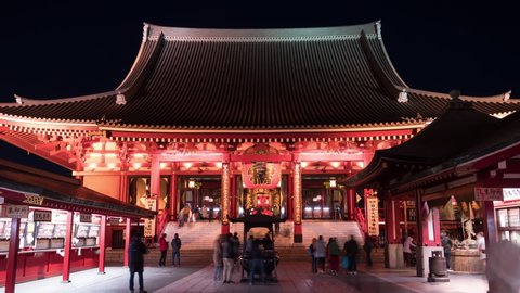 TOKYO, JAPAN - 2020 circa: Crowd of people visit Sensoji Temple in Asakusa before closing. It is Tokyo's oldest temple, and one of its most significant. 4K night time-lapse.
