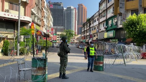 PETALING JAYA, MALAYSIA - MAY 14, 2020 : Malaysia soldier officer control the road near Jalan Pudu during the 'movement control order' COVID-19 outbreak.
