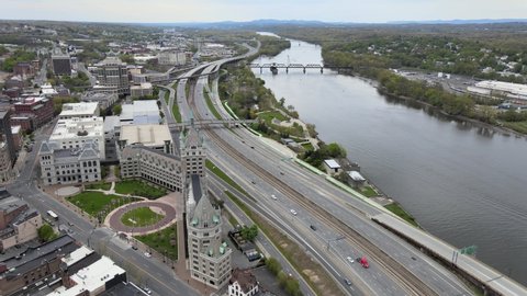 Albany, New York  United States - May 14 2020: Aerial Footage of Albany Skyline, highway i-787, and the Hudson river.