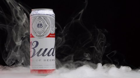 Beer Bud can with smoke, black background. MINSK, BELARUS, May 15, 2020.