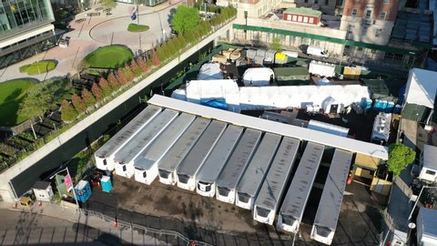 NEW YORK - CIRCA 2020 - An aerial view over temporary morgue refrigeration trailers containing the bodies of victims of the Covid-19 epidemic.