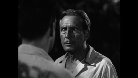 CIRCA 1951 - The foreman of a tropical rubber plantation (Raymond Burr) fights with his boss over the man's wife, and pushes the man onto a snake.