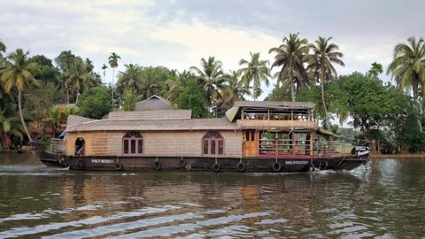 Alleppey, India - November 28, 2019: Traditional houseboat at beautiful backwaters in Alleppey, Kerala, India