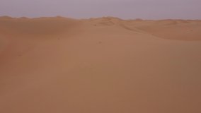 Endless sandy Arabian desert. Aerial low angle video. Dry landscape. Untouched nature. 