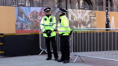 Manchester, United Kingdom - 3rd Oct 2019: British police officers standing in the city centre of Manchester.