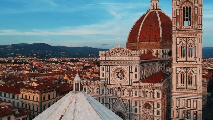 Aerial close up view of Florence Cathedral, Firenze Cattedrale di Santa Maria del Fiore ,Duomo di Firenze, Florence, Italy on a sunny day Royalty-Free Stock Footage #1052549654