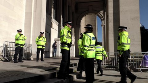 Manchester, United Kingdom - 3rd Oct 2019: British Police Officers standing in the city centre in hi vis uniform while at a protest.