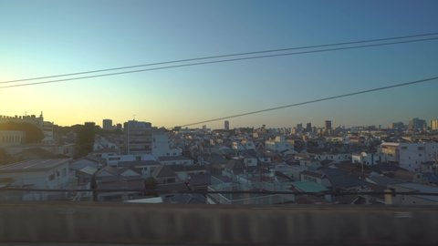 Tokyo, Japan - NOV 09, 2019: View from the window of the train passing by the city