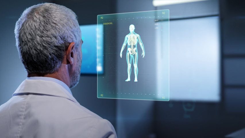 future medical  technology,doctor looking at augmented reallity virtual touchscreen display showing 3d graphics of brain heart and human body

 Royalty-Free Stock Footage #1052573657
