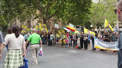Sydney NSW Australia - Feb 15 2020: large group of people crowd demonstate for freedom movement for ocnlan demonstration near sydney city hall park state of kurdistan, holding flags and banner