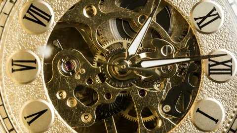 Antique pocket watch mechanism gears running in timelapse 4k extreme macro closeup