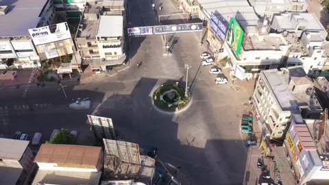 Bharuch, Gujarat/India- May 05,2020: Aerial shots during lockdown due to COVID 19 coronavirus pandemic in India. Empty roads. Railway station. Shops closed in city life for prevention.