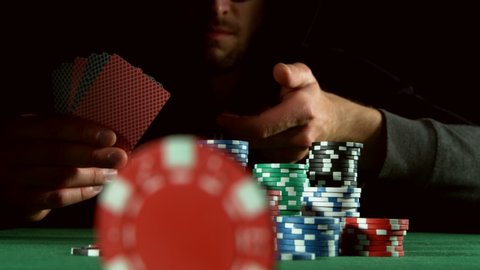 Super slow motion of poker player throwing chip towards camera. Filmed on high speed cinema camera, 1000fps.