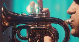 Musician playing and recording on Trumpet at home studio. Jazz, Blues, Rock, Pop Music style. Artist hobby, Create own melodies and songs, learning online. 4K video.