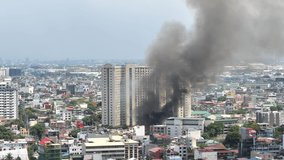 Fire hits squatter area in Pasay - Philippines May 17, 2020. Video is taken from one of high rise condo building in Makati city of Manila - Philippines