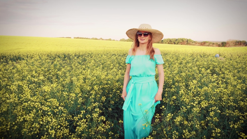 Young woman standingon the rape with sunrise on the background