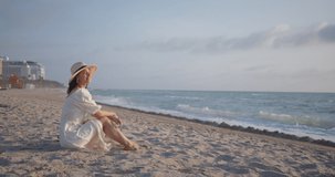 Attractive girl on the beach in Miami. Shot on Black Magic Cinema Camera