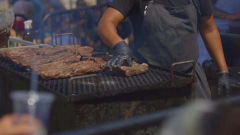 New York,NY / USA - August 12, 2019: Bbq ribs sale on the Smorgasburg event on Williamsburg, Brooklyn, Marsha P. Johnson State Park (a.k.a. East River).