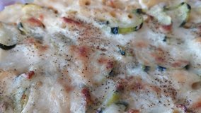 4K video, Close up view of Zucchini noodle gratin with bechamel sauce