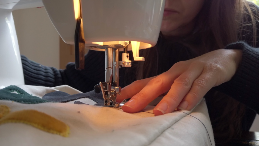A woman using a sewing machine