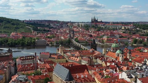 Panoramic view from above on the Prague center, aerial of the Prague city, view from above on the cityscape of Prague, flight over the city, top view, Vltava River, Charles Bridge, Prague, Czechia.