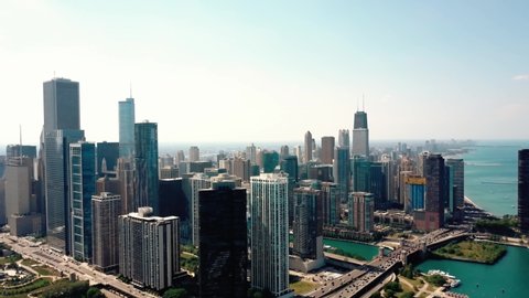 Drone Aerial view of Chicago, sunny day view on Millenium park and Boats Parked in Bay