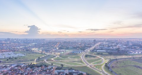 Aerial Hyperlapse of Ring Road in Ribeirao Preto during sunset showing the city lights switching on in the countryside of Brazil