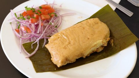 Peruvian food, tamales verdes. Fresh corn and coriander leaves are the basis of these delicious homemade green tamales.