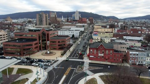 Reading , PA / United States - 01 29 2020: Reading Pennsylvania downtown, wide cityscape aerial drone view of traffic during winter morning commute, intersection, businesses