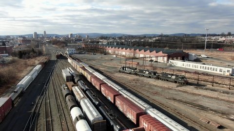Reading , PA / United States - 01 29 2020: Wide angle aerial pullback drone shot reveals Reading Railroad yard, switching station in Berks County, PA