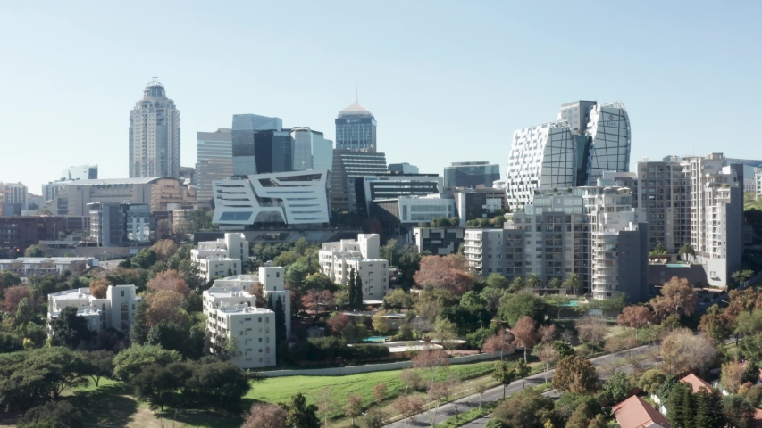 Aerial view of the Sandton skyline on a sunny day in Johannesburg, South Africa. Royalty-Free Stock Footage #1052651468