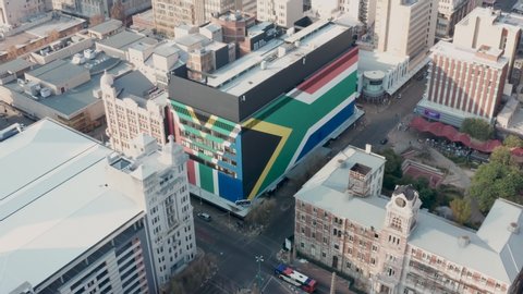 Johannesburg, South Africa - May, 10, 2020: Aerial view of a huge South African flag painted on a building in Johannesburg city centre.